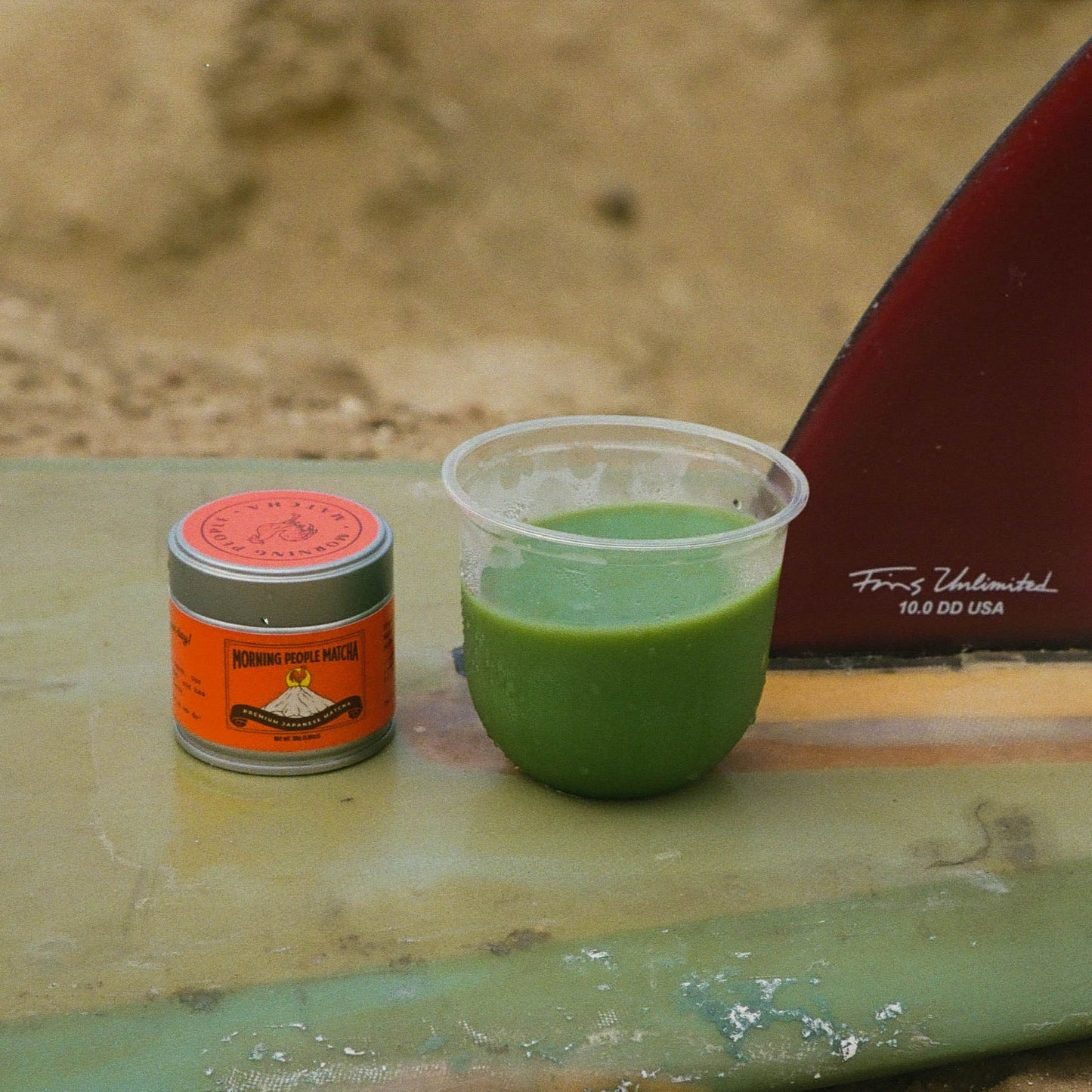 Morning People Matcha on surfboard